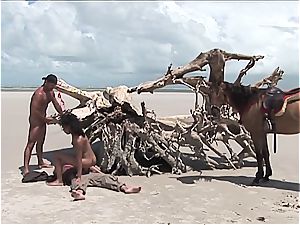 naughty latin dame gets 2 shafts on the beach